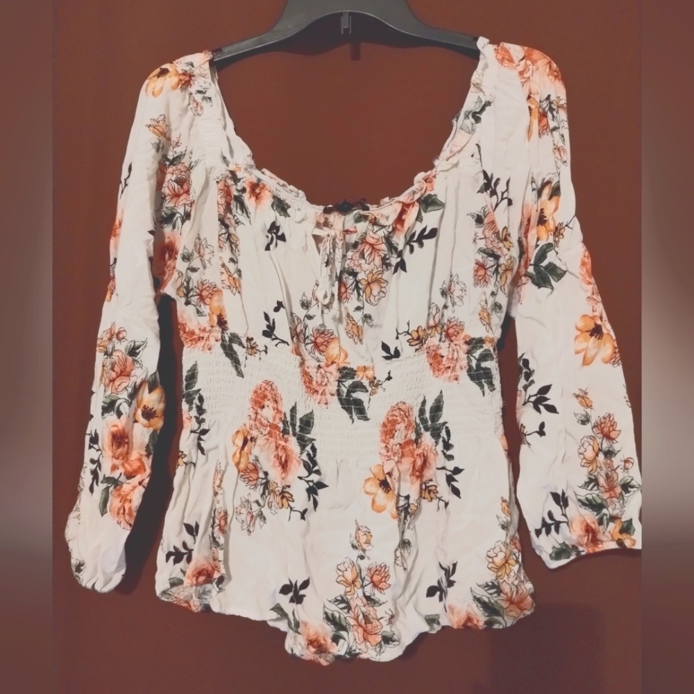 Floral flowy peasant blouse with cinched waist.